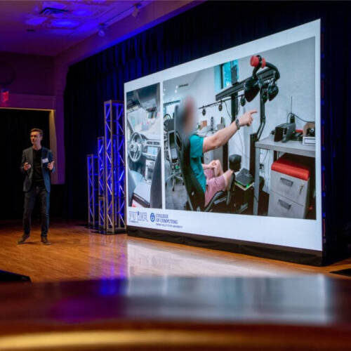 Paul Fink, assistant professor in the College of Computing, speaks as part of "Tech Talks: AI & Human-Centered Design" at the DeVos Center's Loosemore Auditorium in Grand Rapids on September 18